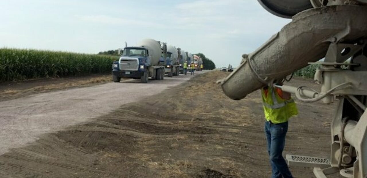 concrete truck pouring new road